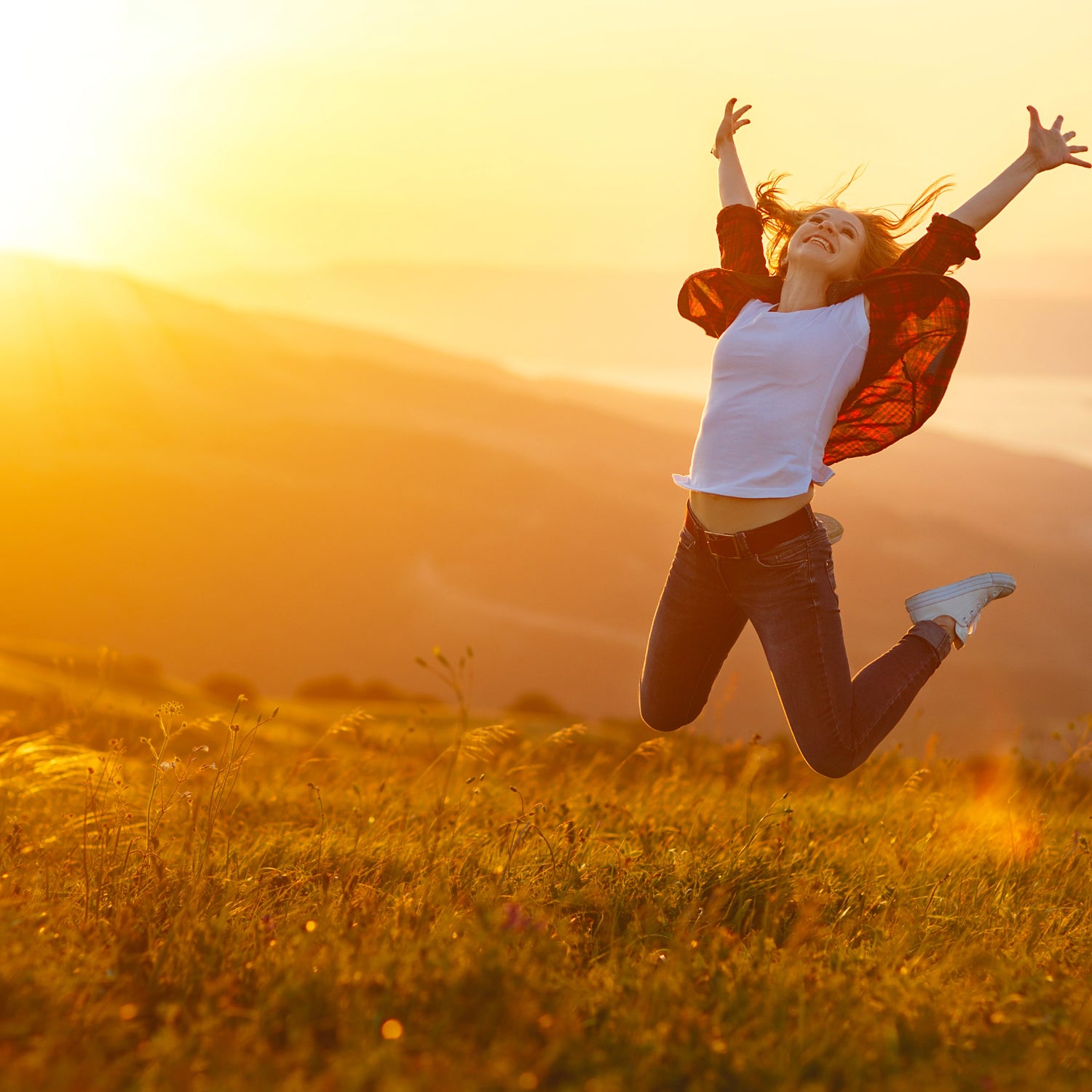 Healthy woman celebrating her reclaimed wellness and energy all thanks to Headley Holistics guidance and products